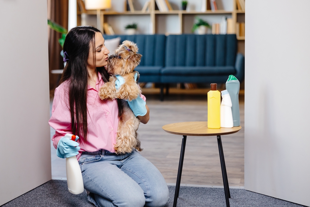 woman with dog pet-safe cleaning products